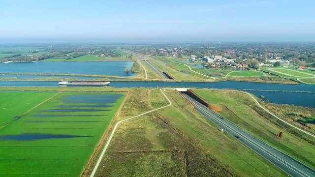 Big Cargo Boat Approaching an Aqueduct, Friesland - The Netherlands / Holland 4K Drone Footage