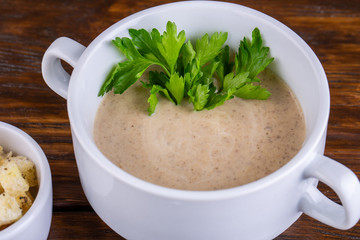 Mushroom cream soup with grenice and greens