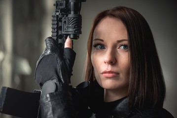 Concept of special agent girl with airsoft rifle.