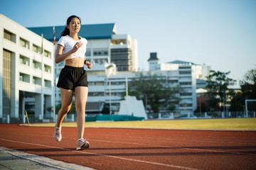 Fototapeta na wymiar Asian woman runners she exercises in the morning