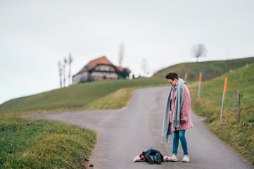 Beautiful woman with short haircut goes for a walk with her pretty daughter