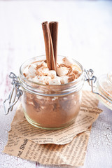 Obraz na płótnie Canvas Cocoa in a jar with marshmallows Close up
