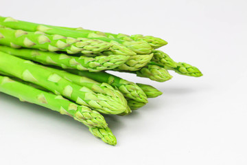 fresh asparagus on wooden table