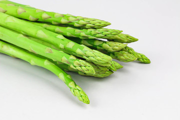 green asparagus on wooden background