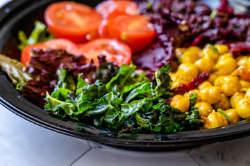 Healthy Kale Salad with Black Rice, Turmeric Chickpea, Cherry Tomatoes / Forbidden Rice or Oryza Sativa.