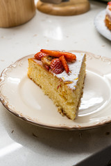 Homemade Victoria Sponge Cake Slice with Strawberry, Dried  Lemon Slices and Powdered Sugar.