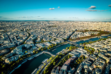 Aerial cityscape of Paris taken from the top of the Eiffel Tower at a sunny afternoon