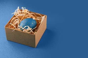 Easter egg painted blue with gold.