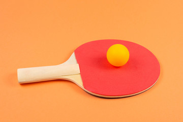 Pin pong on an orange background.