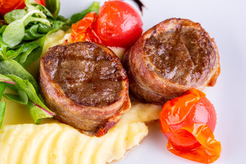 Beef medallions in bacon with potato puree