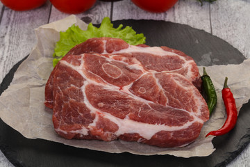Raw pork neck steak