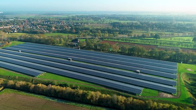 Solar Plant Overview: Rows of Solar Panels Producing Sustainable Energy, Moving Left - Friesland, Netherlands / Holland &ndash; 4K Drone Footage