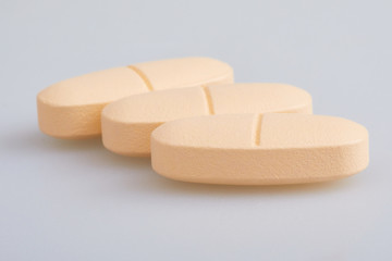 Multivitamin Multimineral Supplement.  Large tablets isolated on white background. 