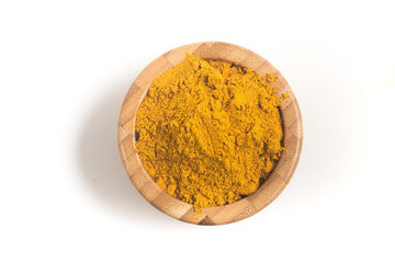 Curry Powder into a wooden bamboo bowl