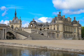 Fototapeta premium External view of famous Chantilly Castle, 1560 - a historic castle located in town of Chantilly, Oise, Picardie .