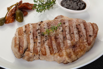 Grilled pork steak with pepper sauce
