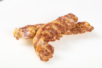 Smoked pork meat over white background