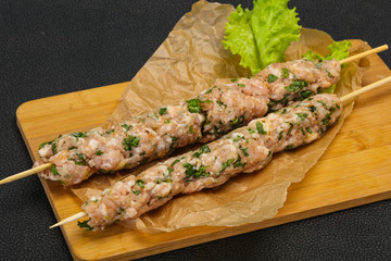 Raw minced pork skewer kebab for grill