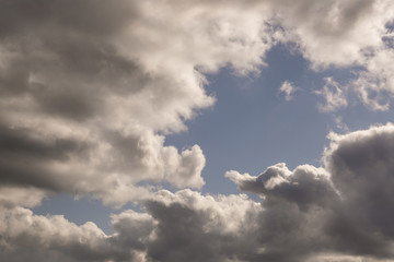 dark Blue sky background with tiny stratus cirrus striped clouds. Clearing evening and Good windy weather