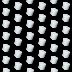 toilet paper on black background. Symbol image for corona crisis panic buying / hoarding, with copy space. seamless pattern.