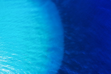 Aerial view at water background. Turquoise and blue water from air. Waves on the sea. Water background - image