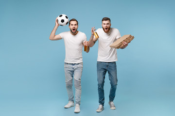 Irritated men guys friends in white t-shirt isolated on pastel blue background. Sport leisure concept. Cheer up support favorite team with soccer ball, beer bottle, italian pizza in cardboard flatbox.