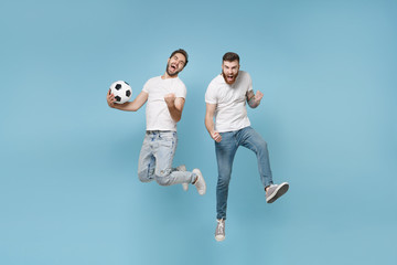 Crazy men guys friends in white t-shirt isolated on pastel blue background. Sport leisure lifestyle...
