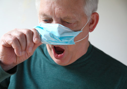 Man With Face Mask Has Trouble Breathing