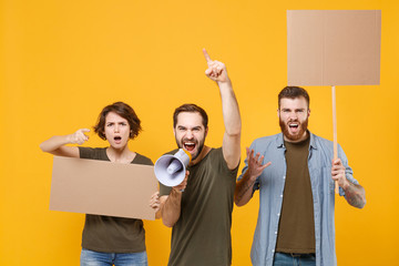 Protesting people guys girl hold protest signs broadsheet blank placard on stick scream in...