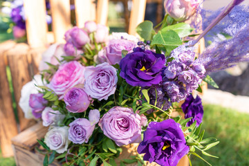 Bouquets of fresh flowers decoration of the festive table. Celebrating an open air party. Decor Details