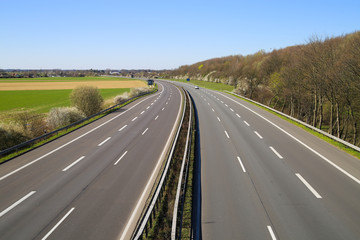 Corona virus crisis stay at home and curfew concept: no traffic on deserted empty german highway...