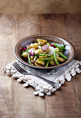  Oven roasted vegetables on rustic wooden background.