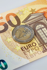 50 Euro currency banknote and 2 Euro coin, EU
