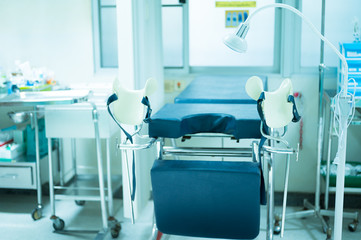 Empty gynecological chair in the clinic.Gynecological bed on the obstetrics and gynecology department in the hospital.Medical equipment concept.