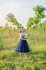 young woman in a forest. little girl in a park