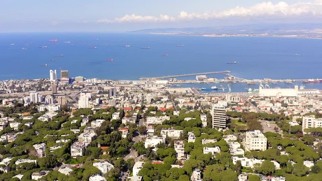Aerial view of Haifa, Israel skyline, showing houses on central Carmel area and full view of the city bay.
