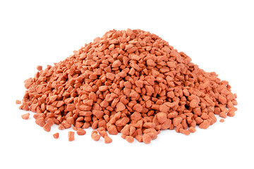 Heap of red mineral fertilizers on a white background. Potassium chloride is isolated on a white background. Granules of mineral fertilizer - potassium chloride. - obrazy, fototapety, plakaty
