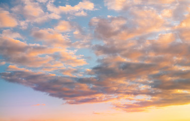 Naklejka na ściany i meble Beautiful colorful bright sunset sky with orange clouds. Nature sky background. 