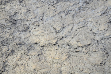  Fragment of a wall of a building covered with cement relief mortar.