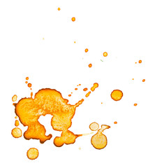 Abstract yellow watercolor stain with small droplets of paint and an orange color gradient. Paint on paper grunge stain texture on a white background