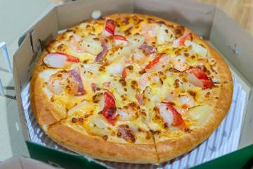 Seafood pizza with shrimp and crab stick.