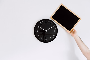 clock and blackboard on white background