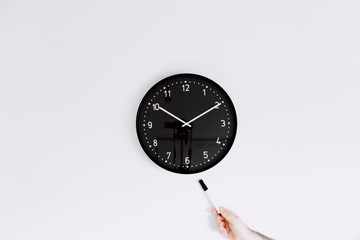 clock isolated on white background and pointing out with marker pen