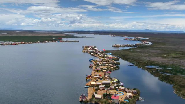 Aerial view of Uros Floating Islands (Spanish: Islas Uros ) on Lake Titicaca, the highest navigable lake in the world, on the border of Peru and Bolivia, South America.