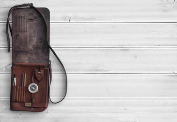 vintage military leather map-case on a white background