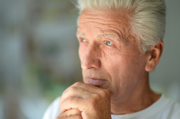 Close up portrait of thoughtful senior man