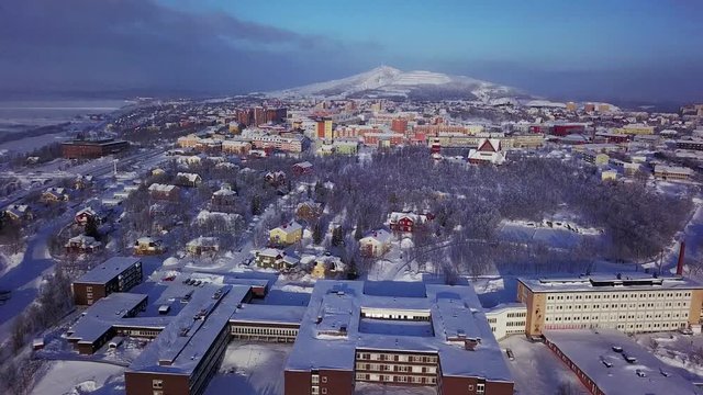 Aerial winter sunny view of Kiruna, the northernmost town in Sweden, province of Lapland, Norrbotten County, footage shot from drone