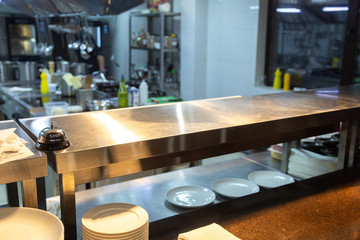 Dishes of ready meals in a restaurant and kitchen in the background