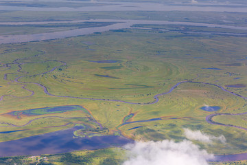 aerial view of Kamchatka volcanos, green valleys, snow and ice and the wonderful view of pure...