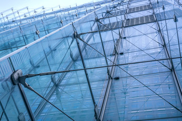 modern building with glass structures, facade fragment, perspective